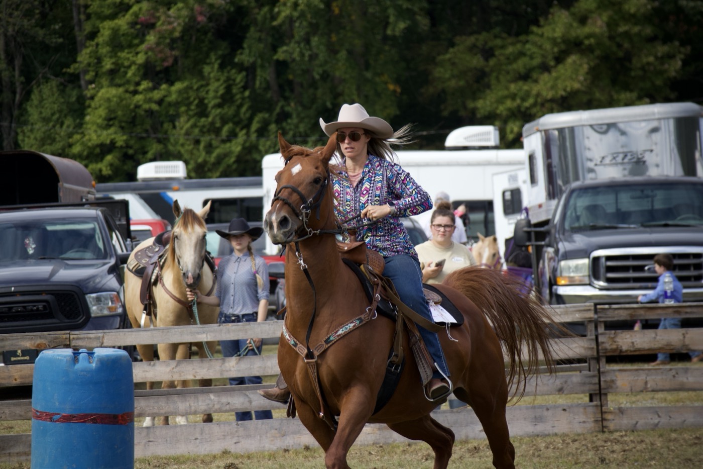 A rider cantering in the gymkhana ring