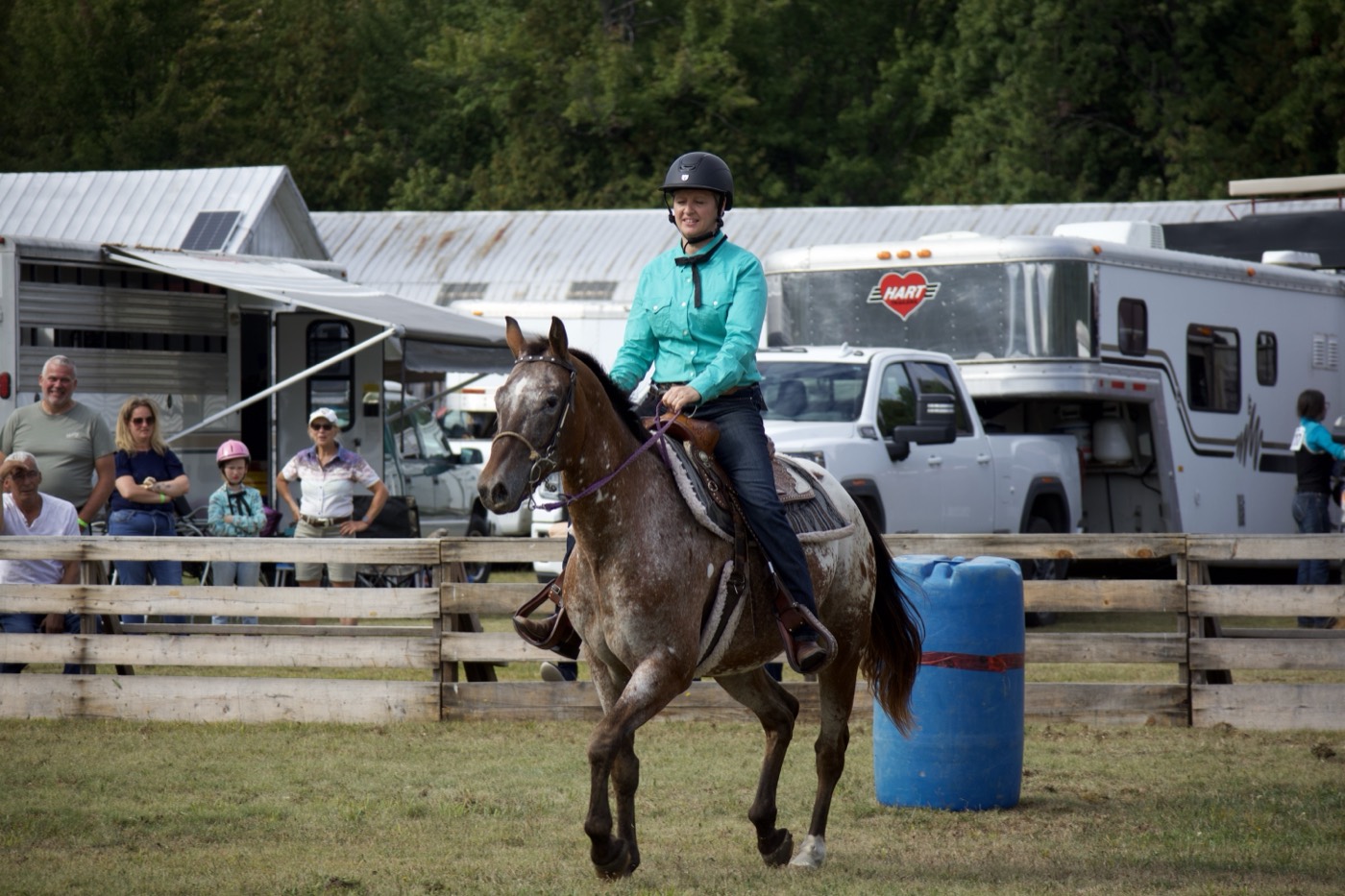 A young rider rounding a barrel