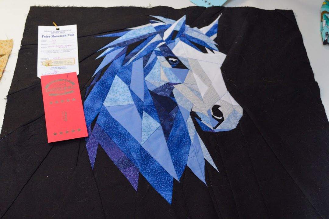 A blue-ribbon quilt in the Havelock Fair exhibit hall